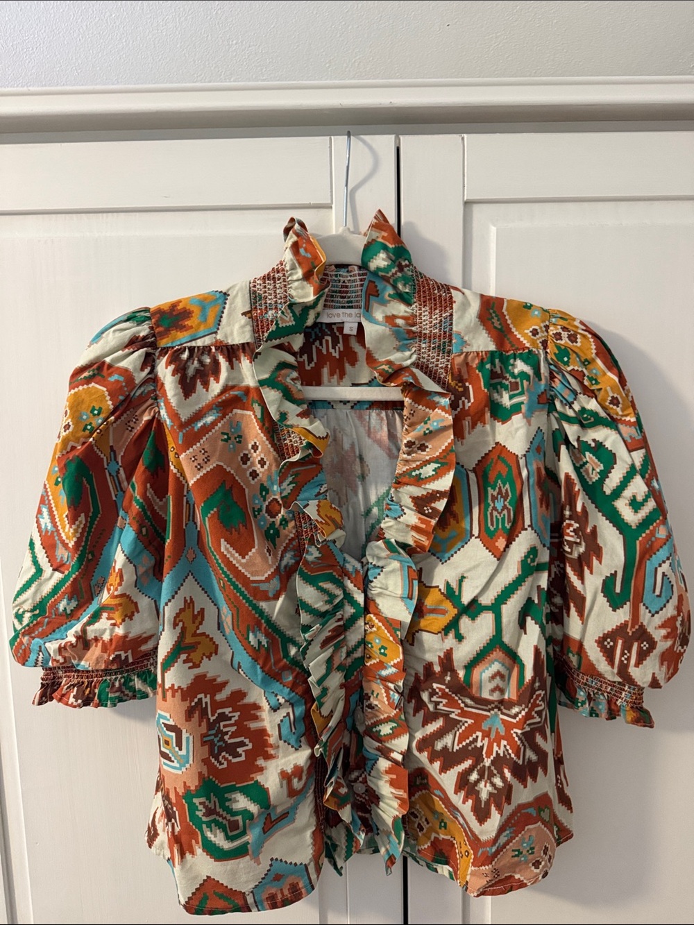 Love The Label Zuri Ruffled Aztec Print Blouse in Teal, Rust & Mustard